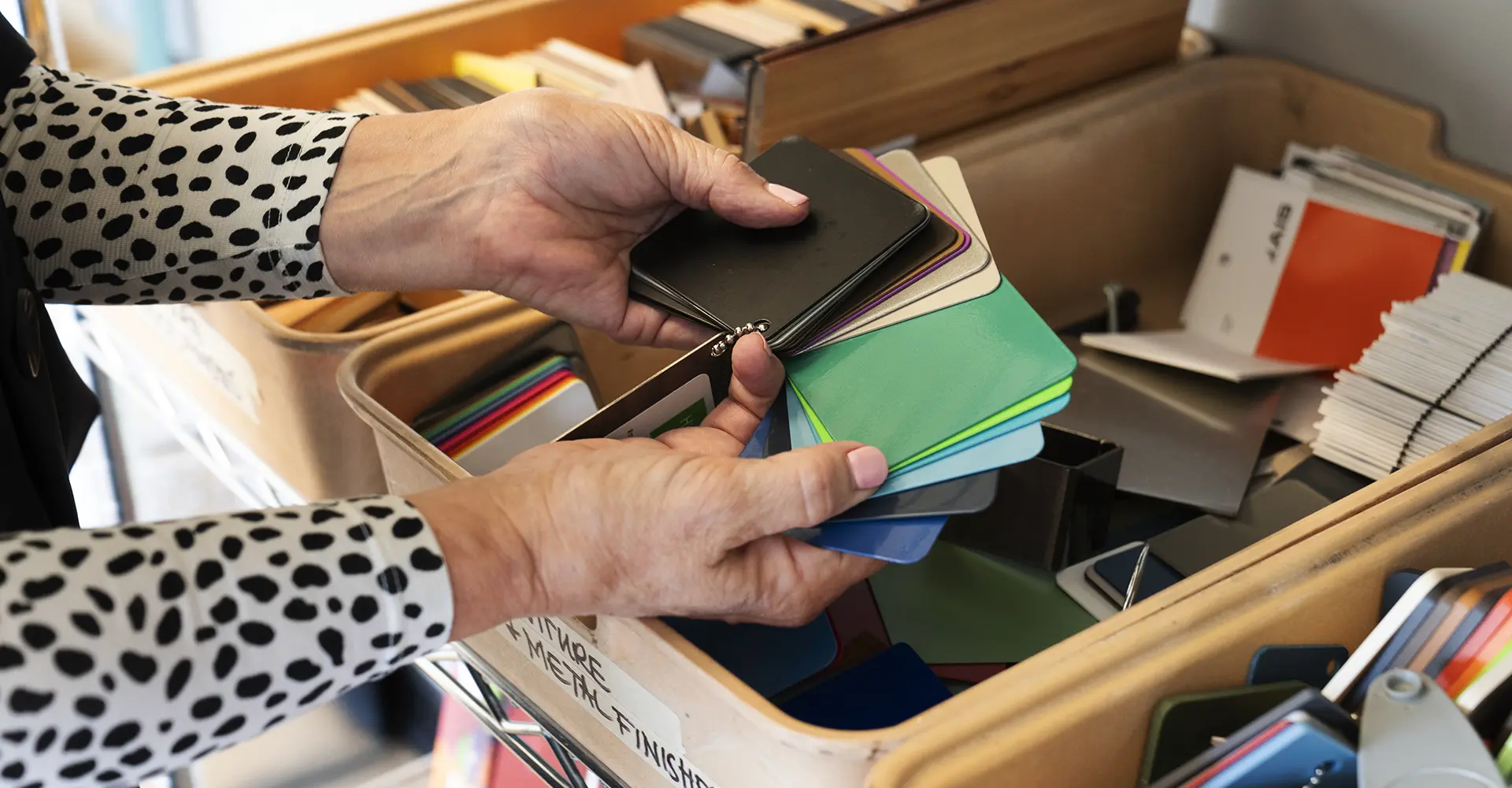 Student looking through color swatches
