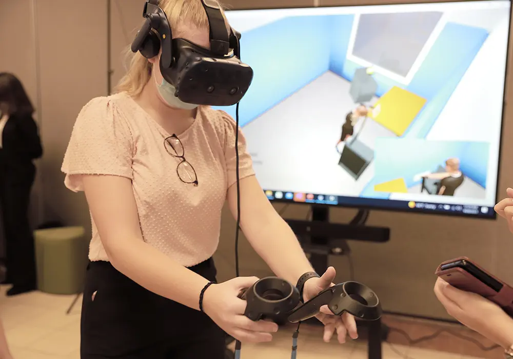 Undergrad students in interior design working with technology