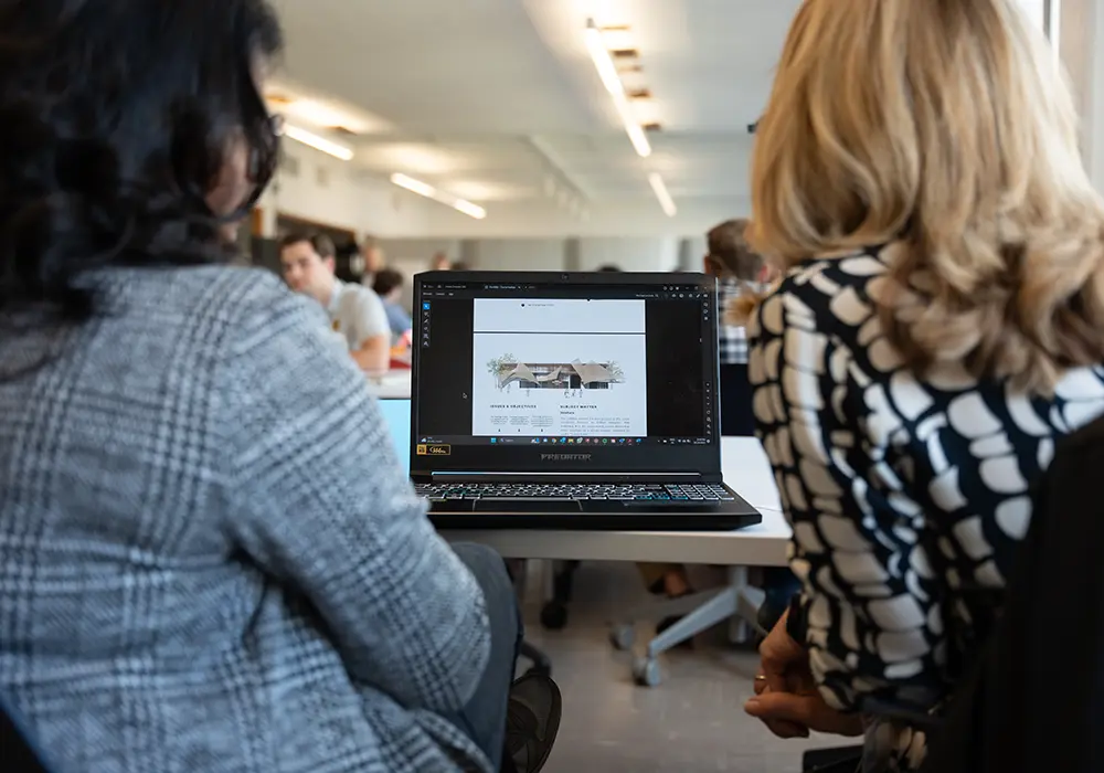 Undergrad students in interior design working on computer