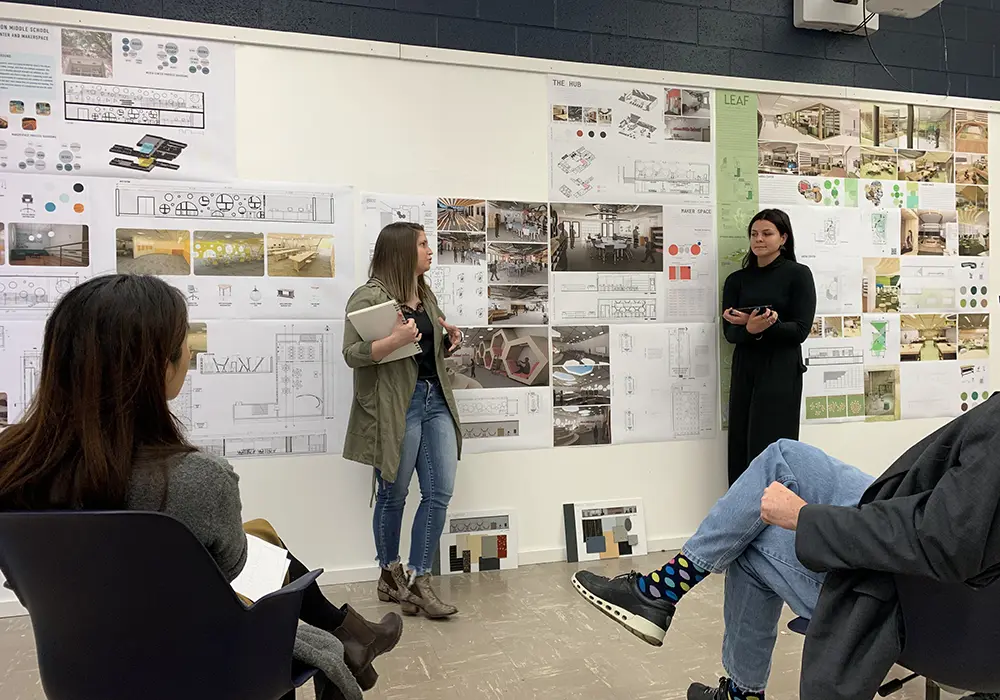 Undergrad students in interior design presenting project to the class