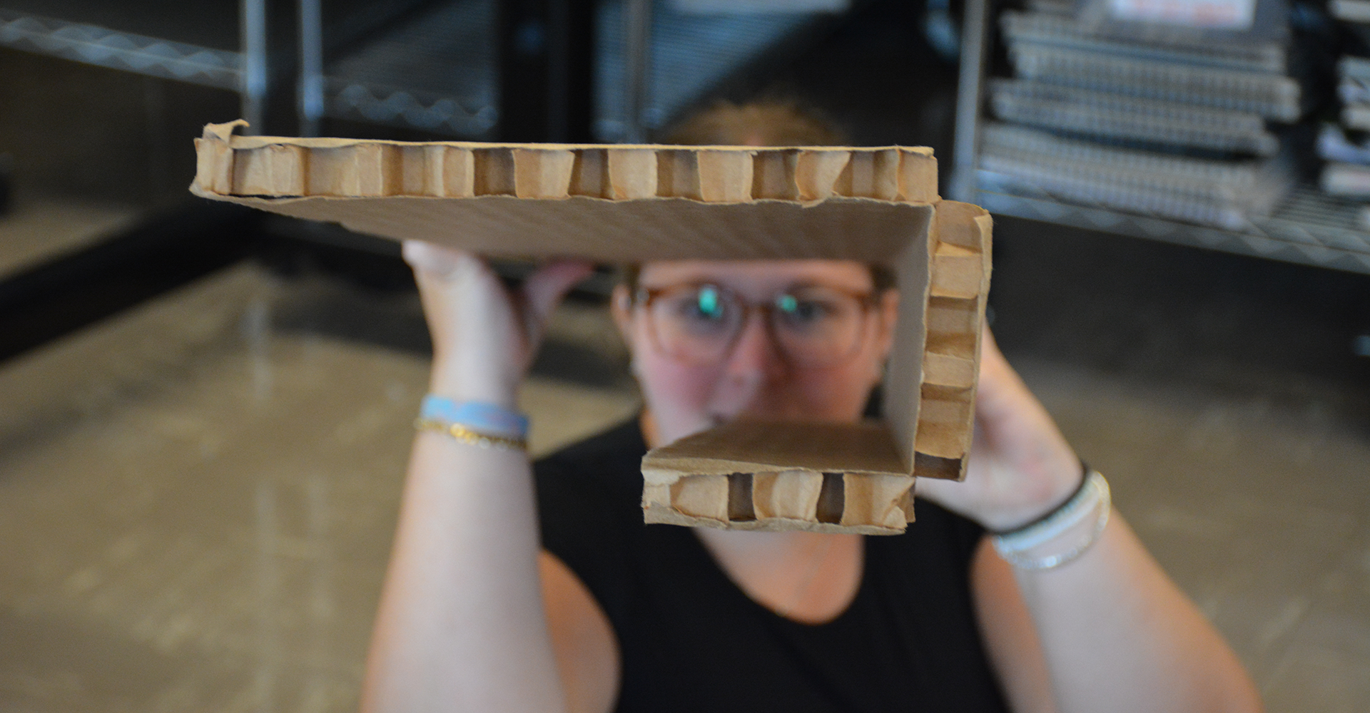 A student looking through material she's making a model with